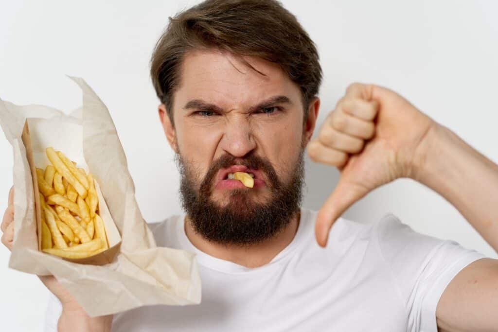 Man saying no to potato fries